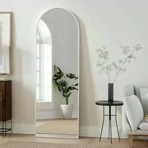 Full Length Mirror White Arch 65x180cm standing against a wall, showcasing modern home decor.