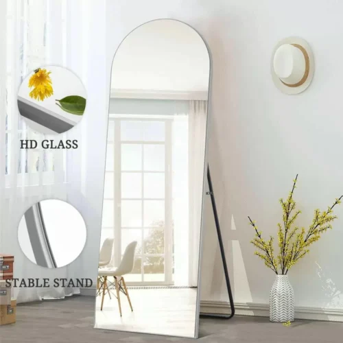 Full Length Mirror Silver Arch 65x180cm standing against a wall, showcasing modern home decor.