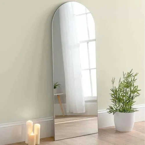 Full Length Mirror Silver Arch 65x180cm standing against a wall, showcasing modern home decor.