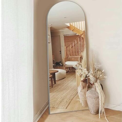 Full Length Mirror Silver Arch 65x180cm standing against a wall, showcasing modern home decor.