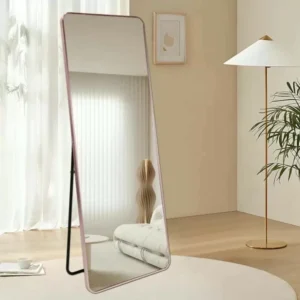 Full-Length Mirror Rose Gold Round Corner 65x180cm standing against a wall, showcasing modern home decor.