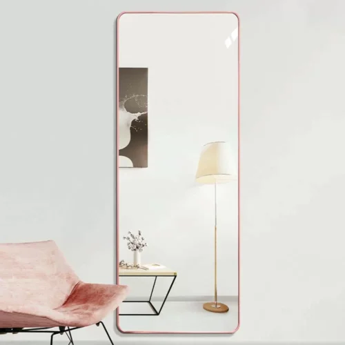 Full-Length Mirror Rose Gold Round Corner 65x180cm standing against a wall, showcasing modern home decor.