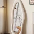 Full-length irregular wavy mirror with white flannel wrapped frame